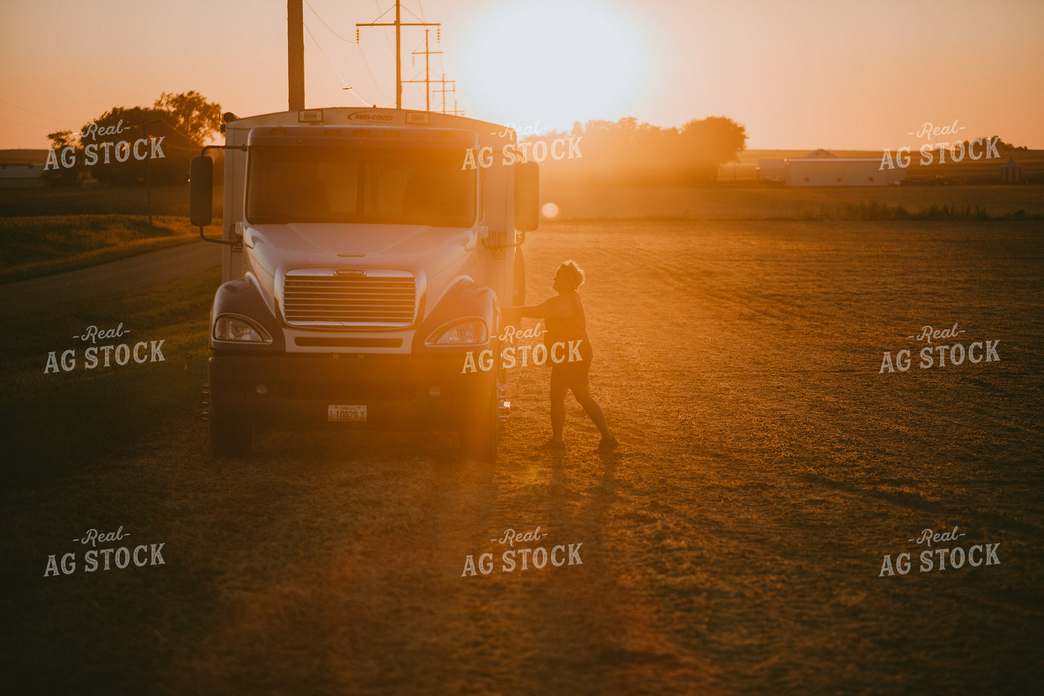 Farmer Walking from Tractor to Truck in Soybean Field Silhouette 4756