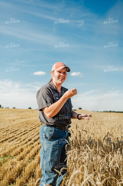 Female Farmer Sampling Wheat 115234