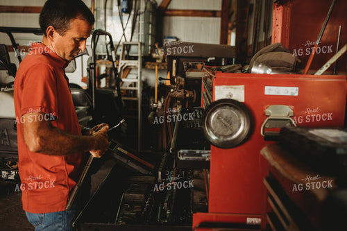 Farmer Getting Tools inside Farm Shop 4513