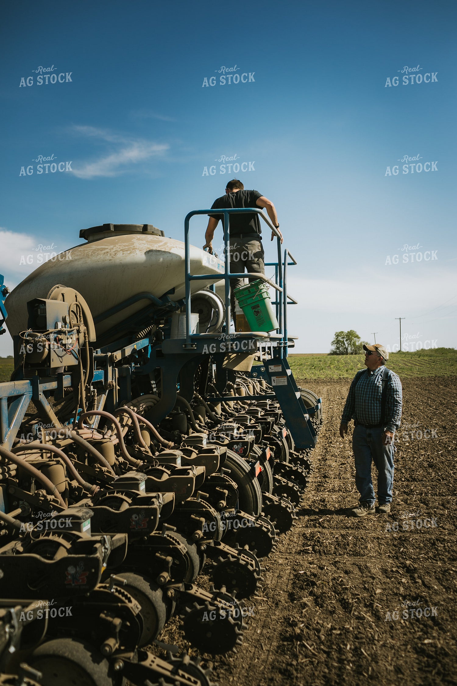 Farmer Checking Seed Level in Bulk Fill Planter 4274