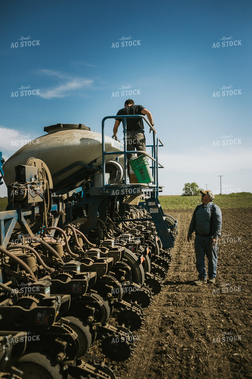 Farmer Checking Seed Level in Bulk Fill Planter 4274