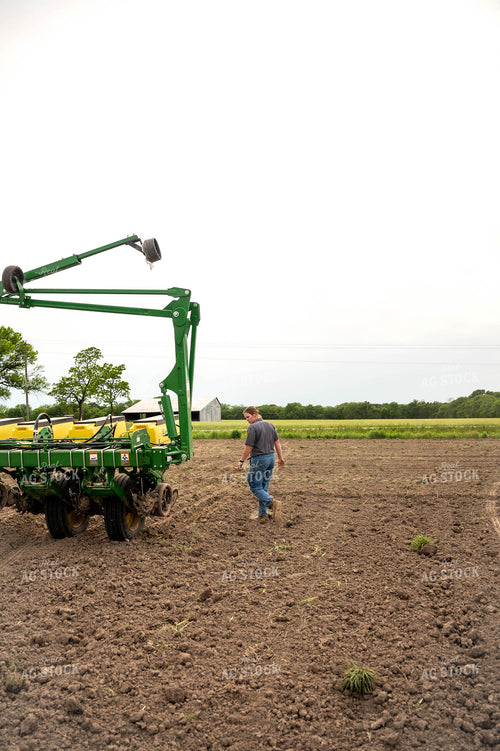 Female Farmer Walking by Planter 115653