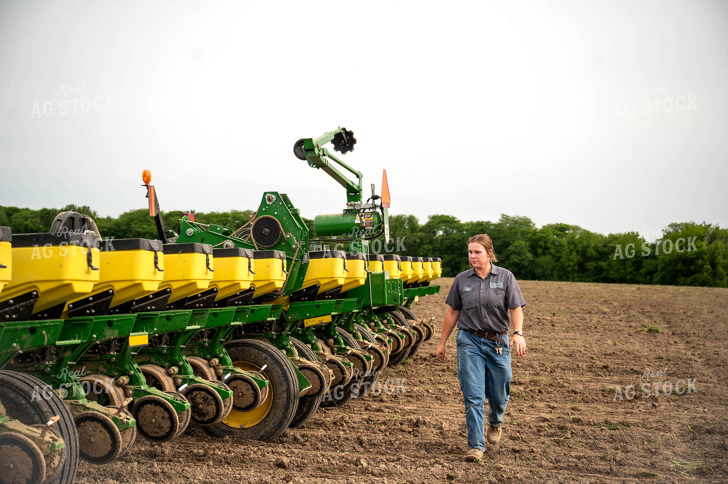 Female Farmer Walking by Planter 115659