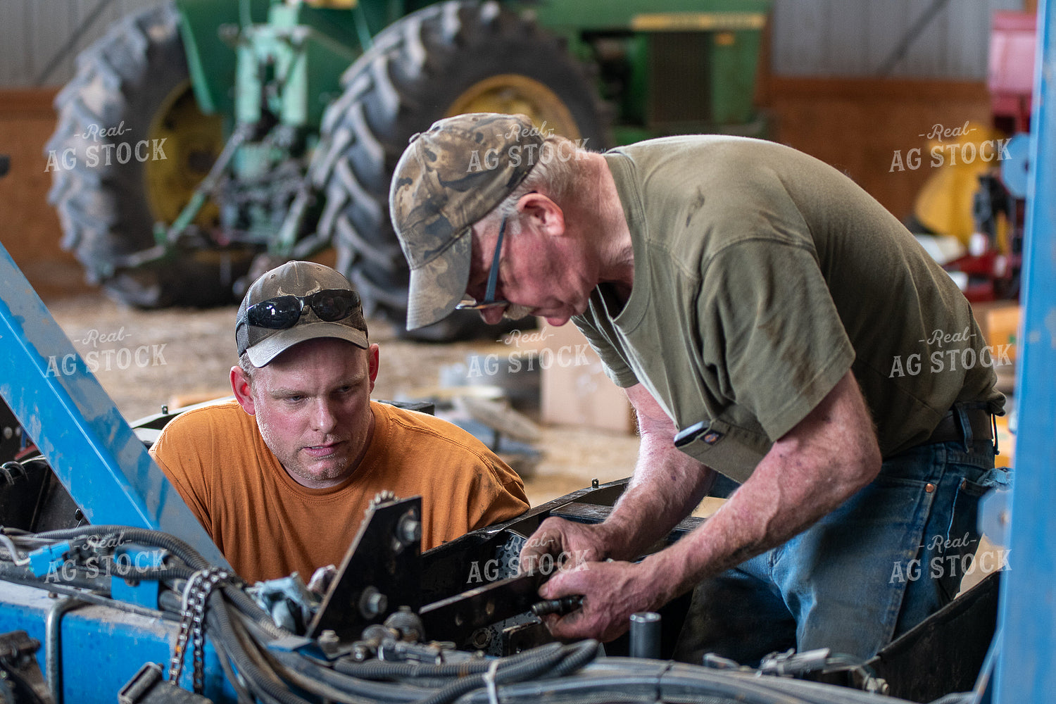 Farmers Working in Shed 50272
