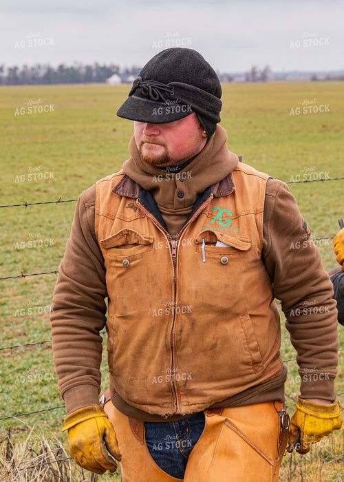 Rancher Fixing Fence 231065