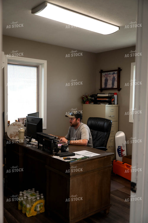 Farmer Working on Computer 115526