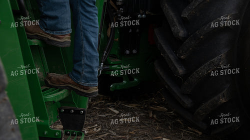 Farmer Climbing into Tractor 26143