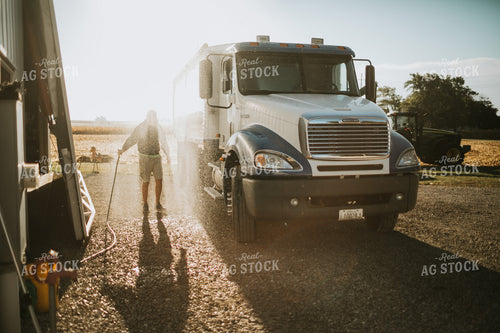 Farmer Hosing off Tandem Farm Truck 4667