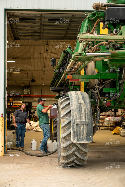 Farmers Filling Self-Propelled Sprayer 115752