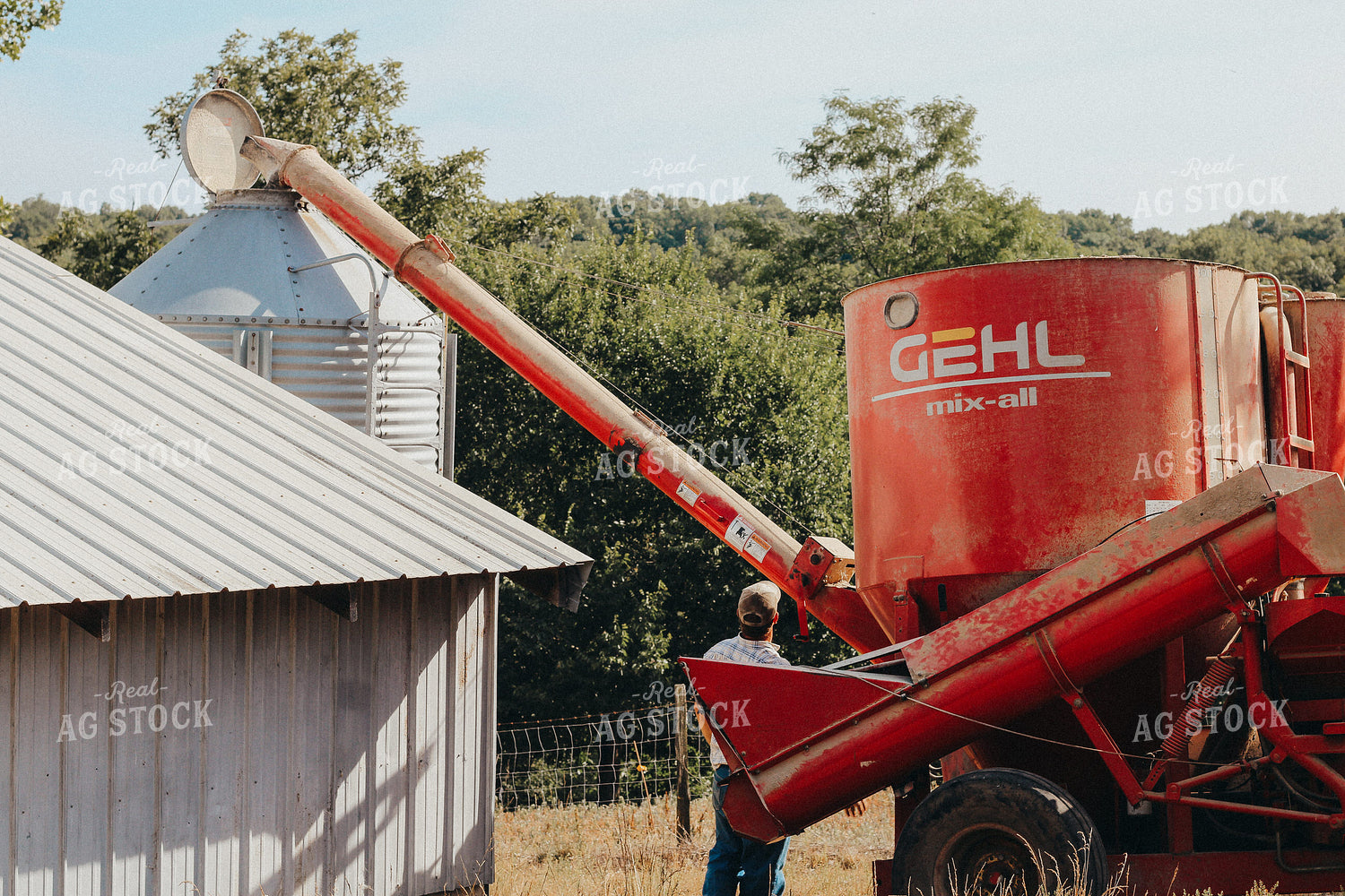 Farmer Loading Bottom Feed Hopper Bin 101050