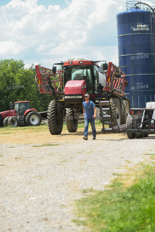 Farmer Walking by Sprayer 191228