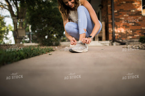 Woman Tying Shoe 5948