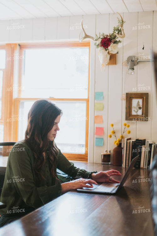 Female Farmer Working on Computer 8479