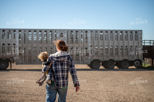 Female Rancher Walking with Farm Kids 212087