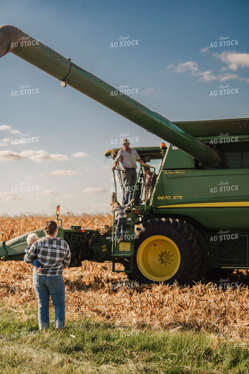 Farm Family Climbing into Combine 115359