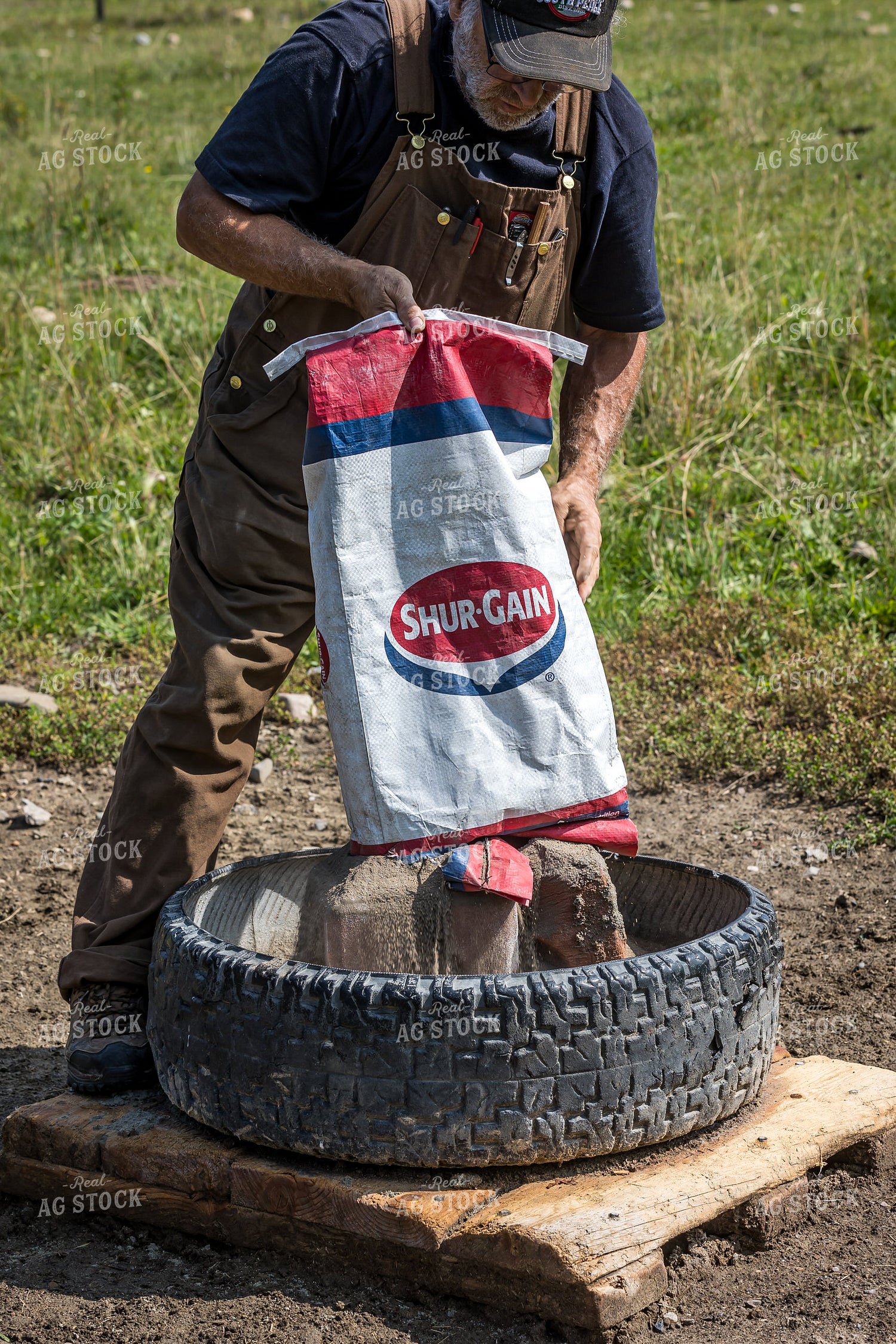 Farmer Pouring Feed 138084