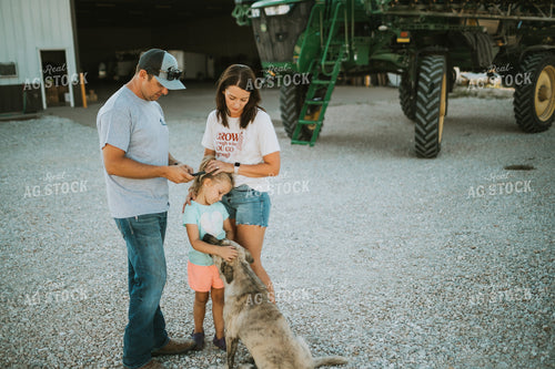 Farmer and Farm Wife Talking Outside Shop Looking at Phone 6240