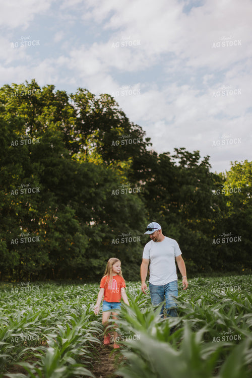 Farmer and Daugther Checking Corn 8748