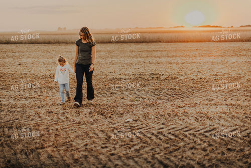 Farm Wife Walking with Daugher in Field 9268