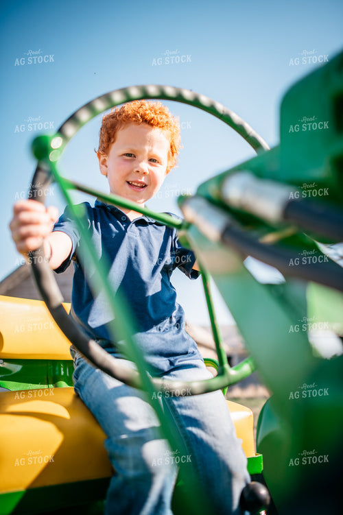 Farm Kid Driving Tractor 56576