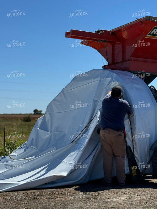 Farmer Setting Up Flat Storage Bag 228029