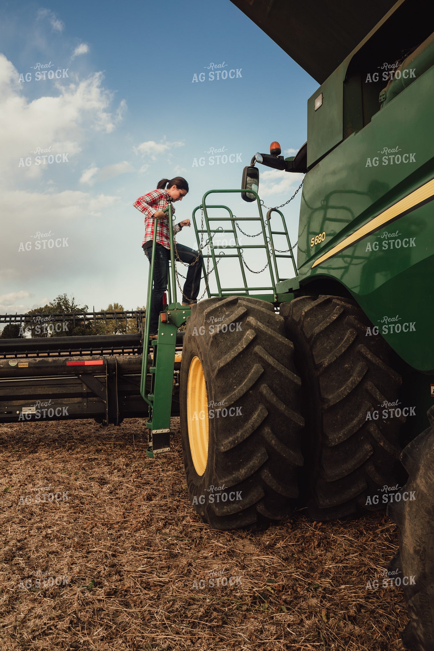 Female Farmer Getting In Out of Combine 3497