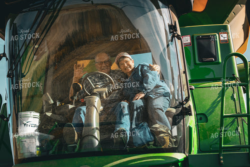 Farmer and Wife in Combine Cab 187040