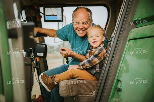 Farmer and Farm Kid in Combine 6640