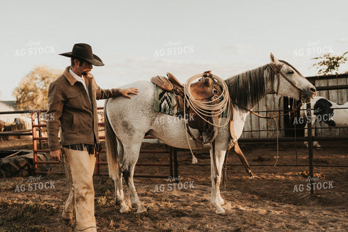 Cowboy Saddling Horse 61178
