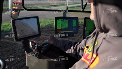 Farmer in the Tractor Cab with Technology - 050