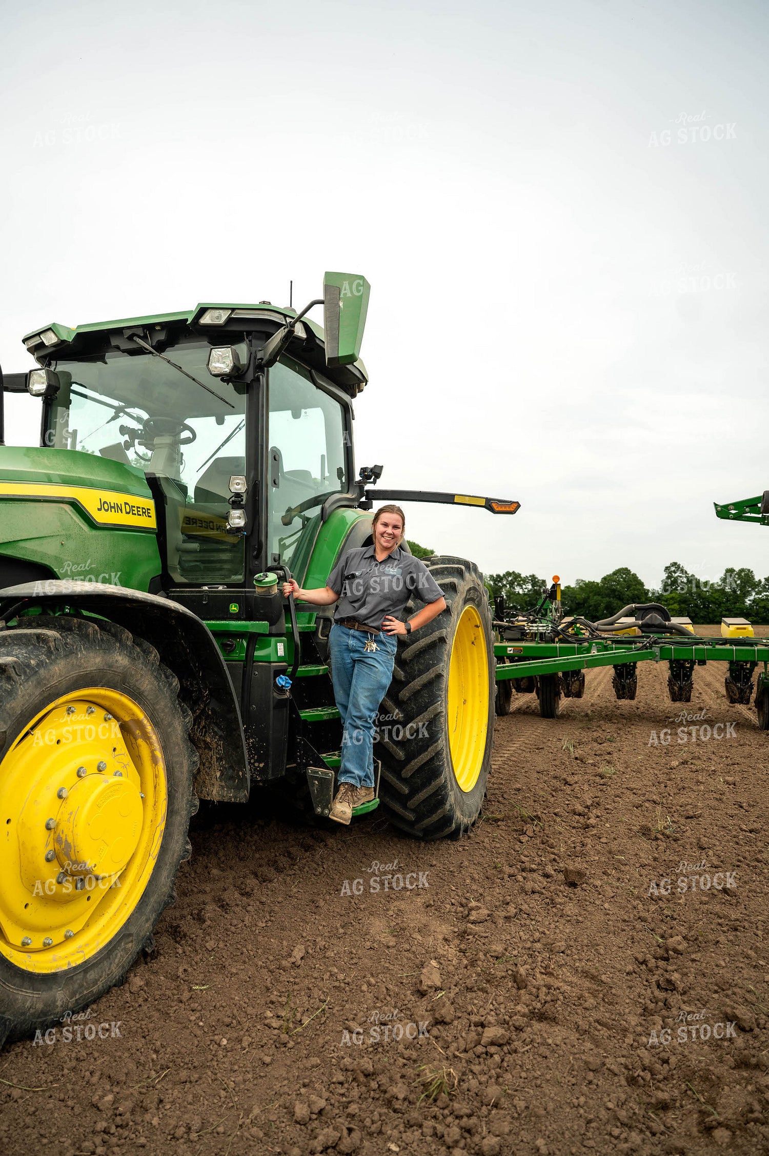 Female Farmer Climbing into Planter 115691