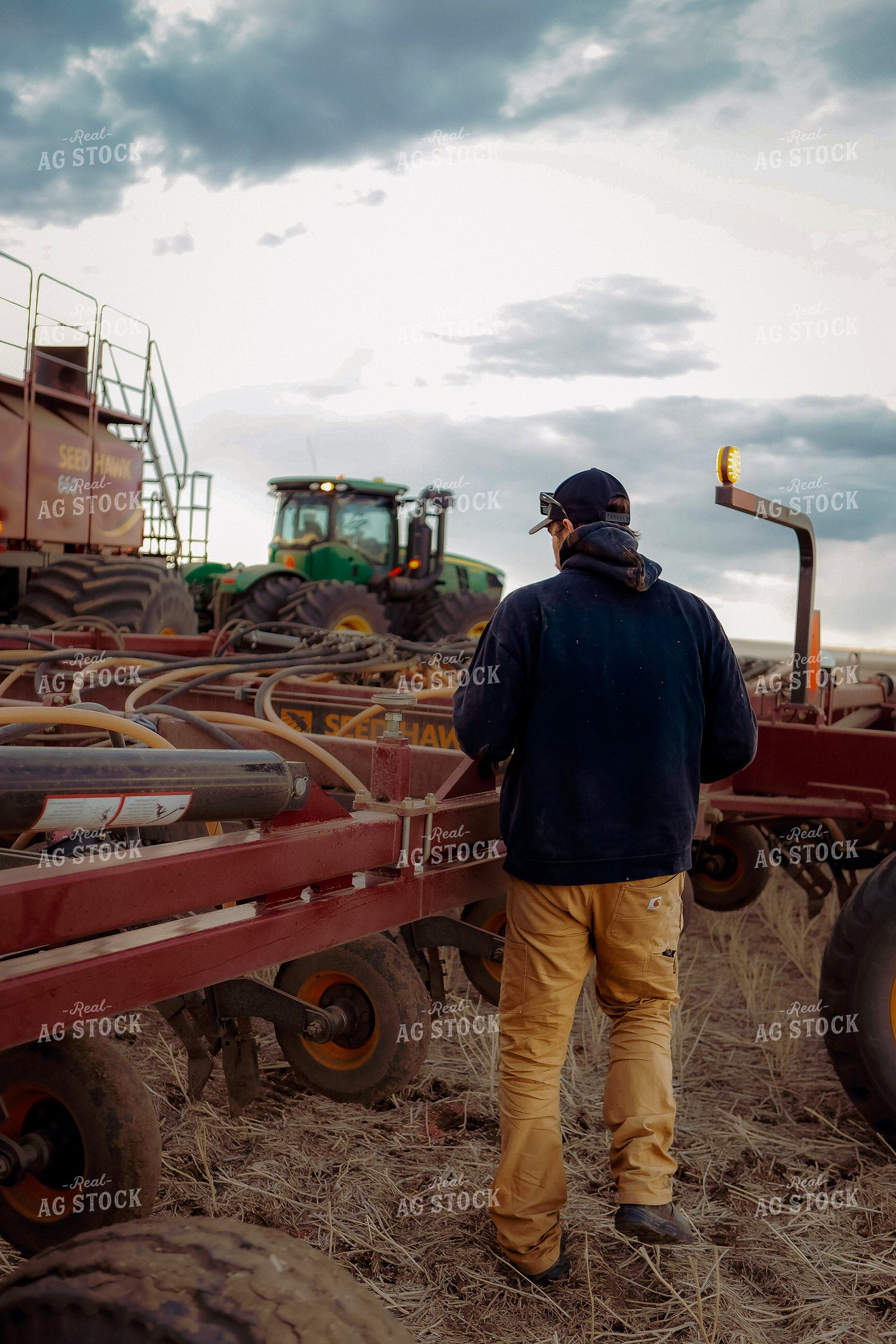 Farmer Checking Air Seeder 187343