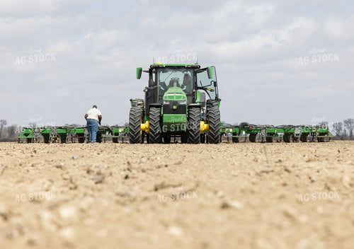 Farmer Fixes Planter 79780