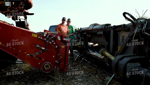 Farmer Directing Combine onto New Head