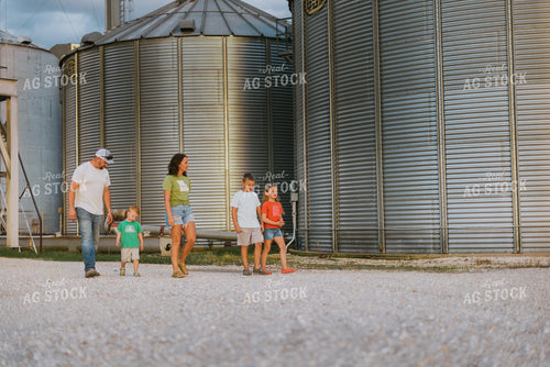 Farm Family Walking by Grain Bins 8778