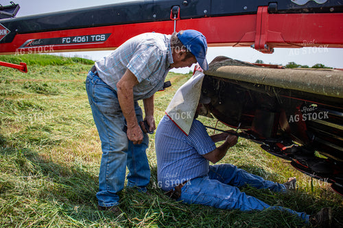 Farmers Fixing Hay Cutter 214141