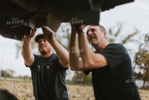 Farmers Fixing Combine 8615