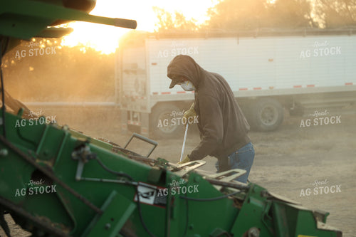 Farmer Blowing out Combine 114093