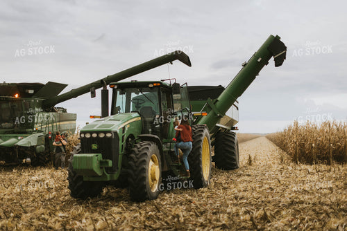 Farmers Climbing out of Harvest Equipment 8585