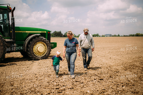 Farm Family Walking by Tractor 169082