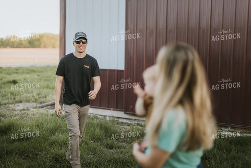 Young Farmer Greeting Family 7644
