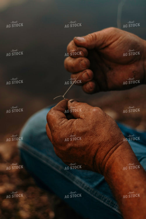 Farmer Tying Fishing Knot 108043