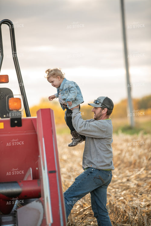 Farmer and Kid Climbing into Combine 76550