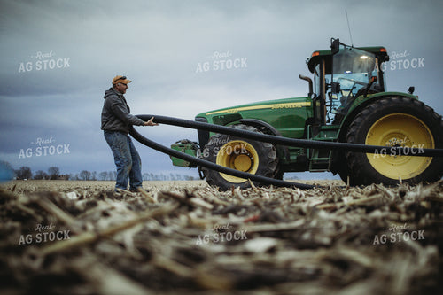 Farmer Laying Out Tile for Tile Plow 3698