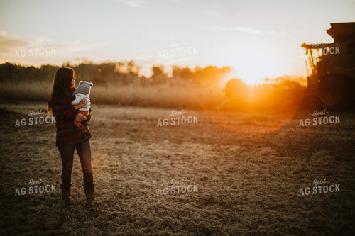 Farm Mom and Wife with Baby in Soybean Field with Combine 5107