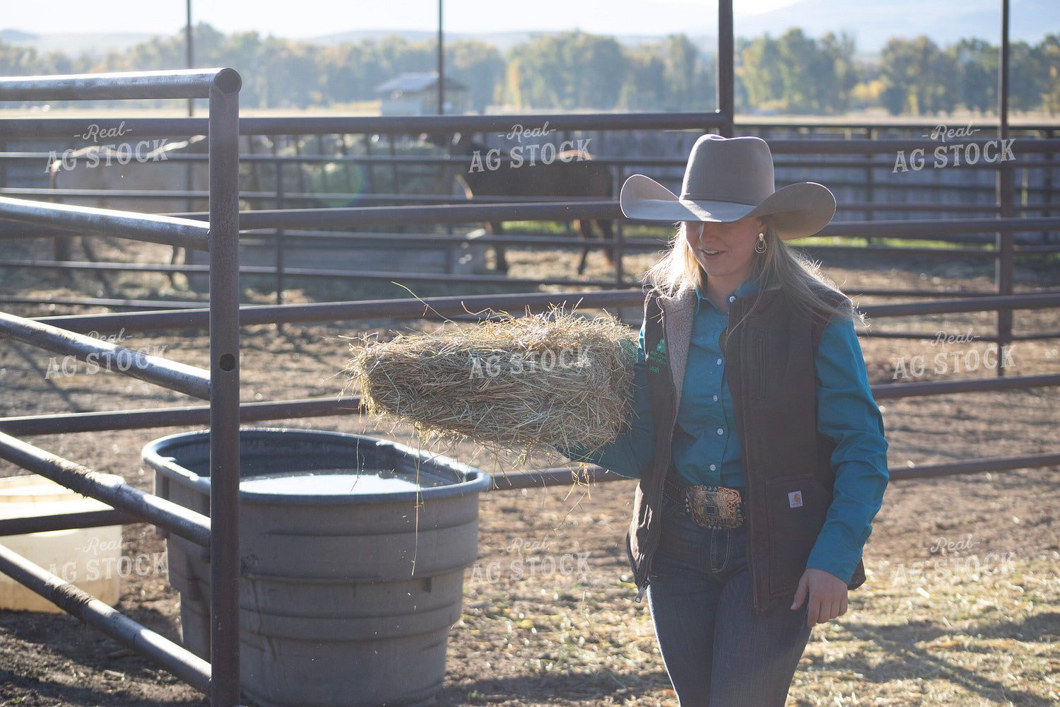 Female Rancher Feeding Horse 117085