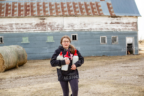 Farm Kid Carrying Calf Bottles 155381