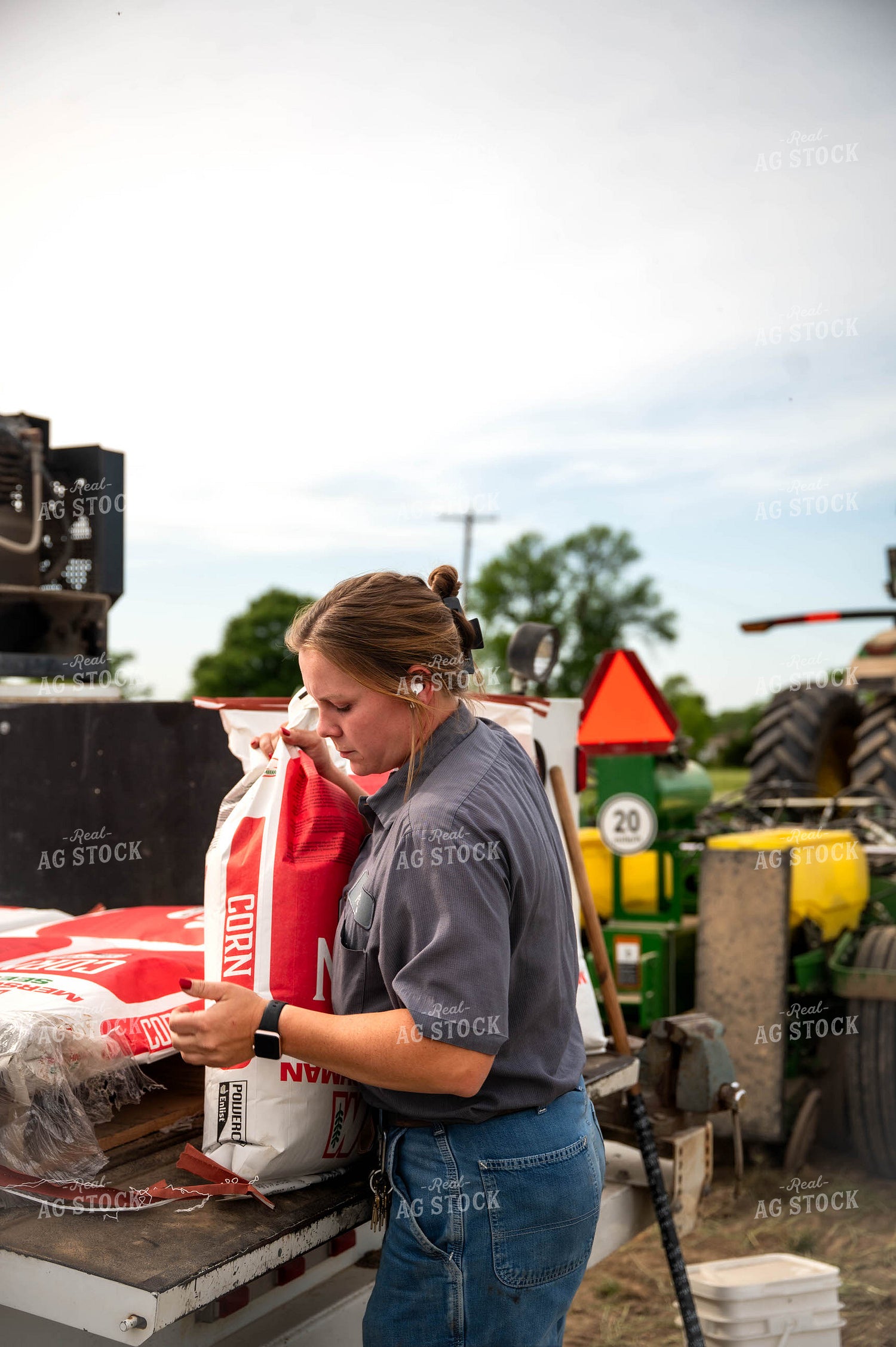 Female Farmer Filling Planter 115626