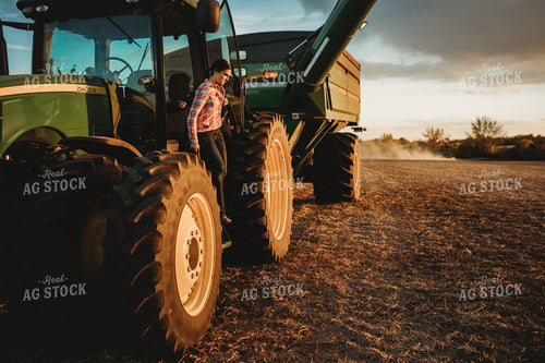 Female Farmer Climbing out of Tractor 3466
