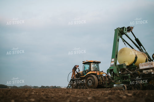 Farmer Climbing into Planter Tractor 5728